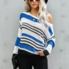 Women in off the shoulder striped sweater