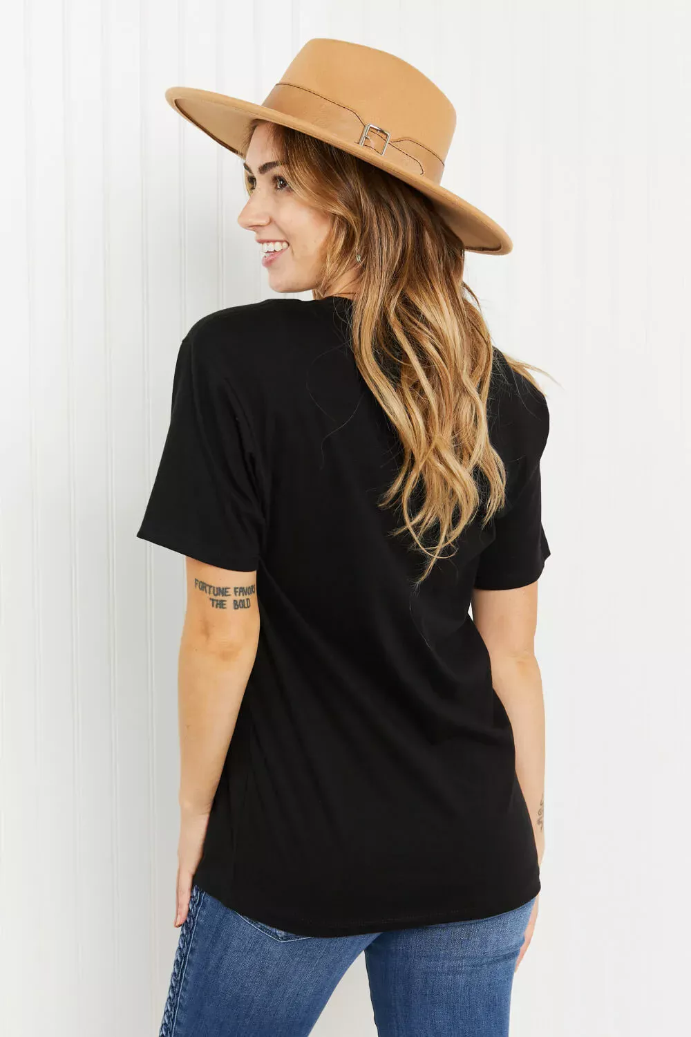 Women in keep it wild graphic tee back view