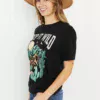 Women in keep it wild graphic tee side view