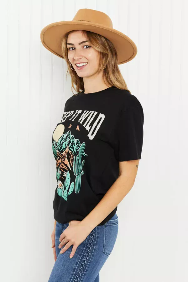 Women in keep it wild graphic tee side view